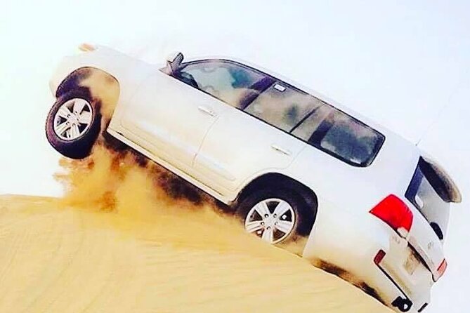 Abu Dhabi: 7-Hours Desert Safari with BBQ, Camel Ride & Sandboarding - Sandboarding and the short camel ride