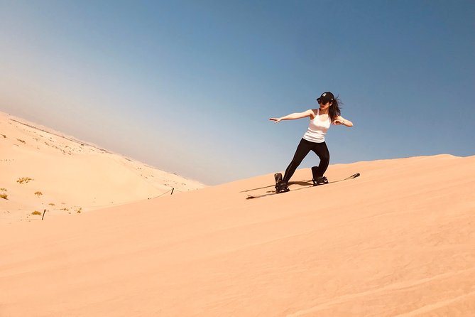 Abu Dhabi Desert safari with BBQ Dinner,Sandboarding & Camel ride - Dune Bashing Across Abu Dhabi’s Sand