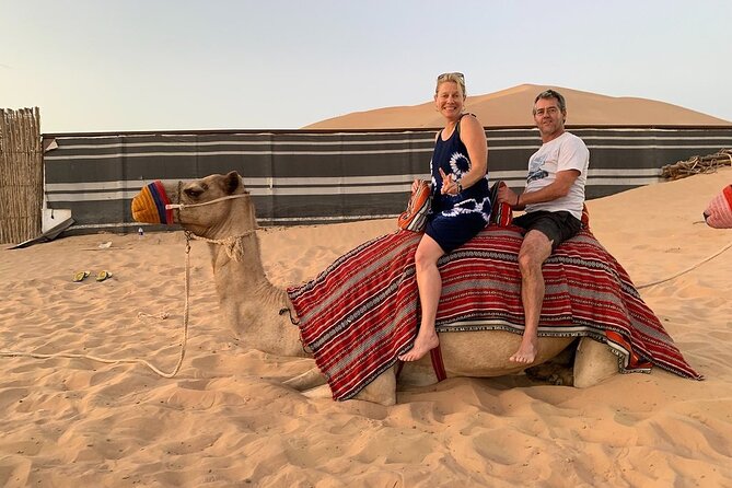 Abu Dhabi Desert Safari with BBQ Dinner & Shows - Sandboarding for a short burst of fun