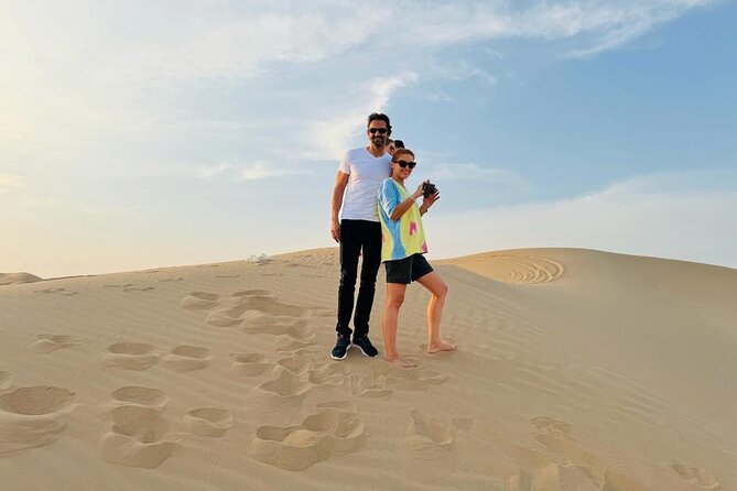 Abu Dhabi Desert Safari With Live Shows And BBQ Buffet Dinner - Camel Rides and Sand Boarding