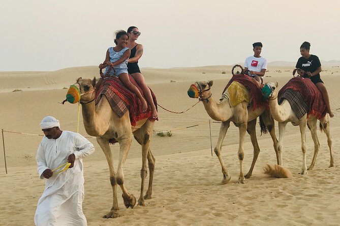 Abu Dhabi Morning Desert Safari,Dune Bashing,Sandboarding,Camel Riding&Quad Bike - Camel riding at the campsite