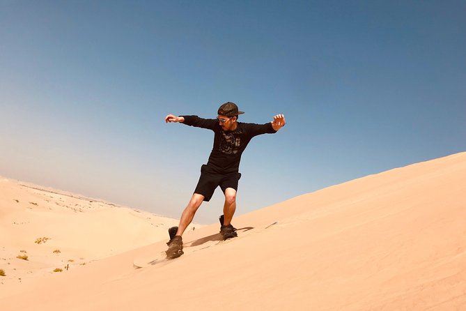 Abu Dhabi Morning Desert Safari,Dune Bashing,Sandboarding,Camel Riding&Quad Bike - Dune bashing across Abu Dhabi’s sand