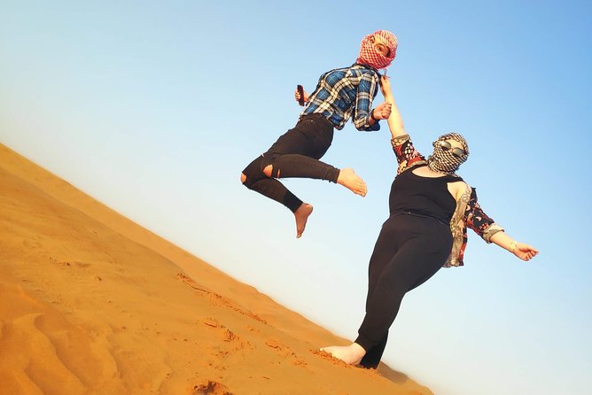 Afternoon Dune Drive Safari with SunSet Photo & Sand Boarding - Sandboarding at the Al Madam dunes