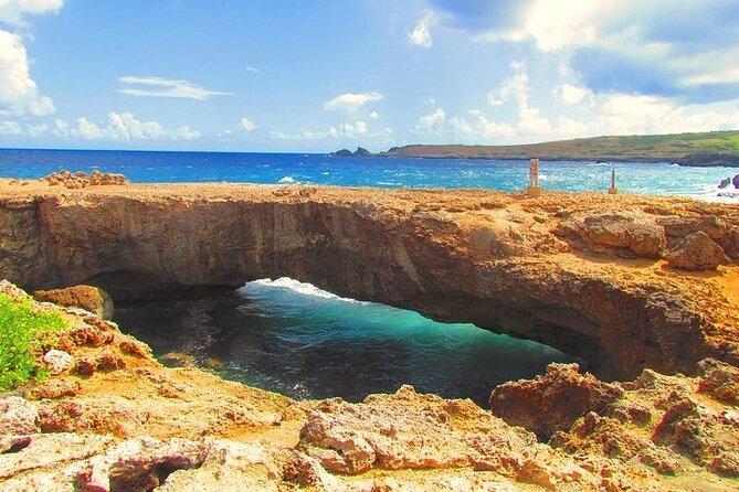 Aruba Natural Pools Northshore Safari Tour - Fontein Cave and Quadirikiri Cave: rock, shade, and old markings
