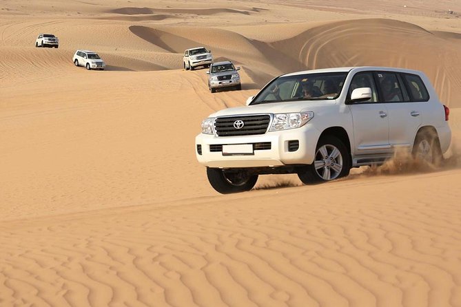 Best Dubai Desert Safari with Buffet Dinner,Sand Boarding & Shows - Sandboarding with no extra charge