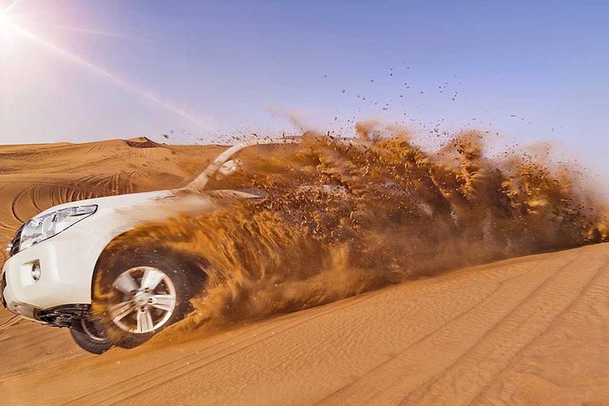 Camel Trekking and Morning Safari with Sand Boarding - Sandboarding down a tall dune