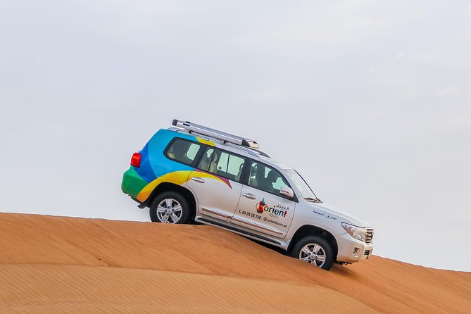 Classic Dubai Desert Safari with BBQ Dinner and Camp activities - Leaving Dubai behind in an air-conditioned 4x4