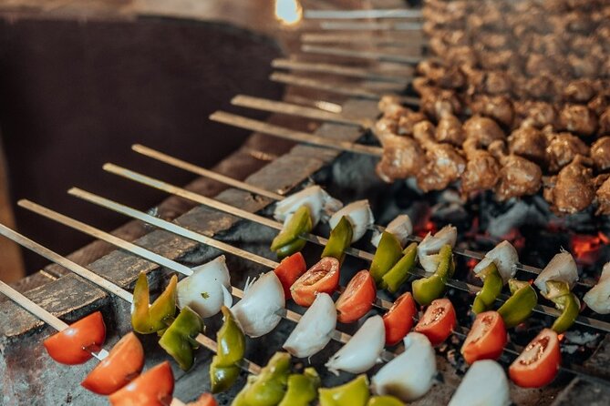Deluxe Sunset Desert Safari: SandSurfing, Camel Ride & BBQ dinner - Three Shows After Dark