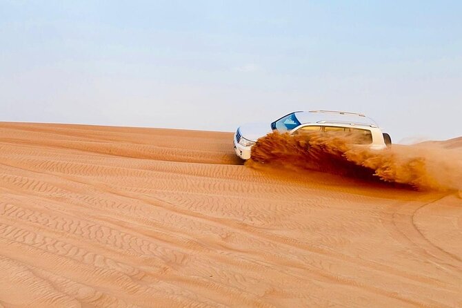 Desert safari adventure with BBQ dinner - Camel riding and sandboarding in 45 minutes