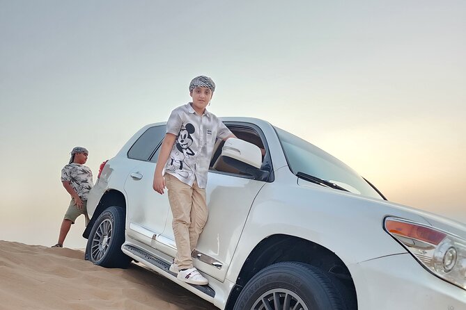 Desert Safari BBQ Dinner, Live Shows, ATV Bikes, Sandboarding - Camel riding, coffee, dates, and camp customs