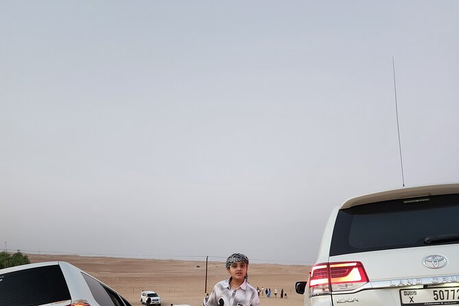 Desert Safari BBQ Dinner, Live Shows, ATV Bikes, Sandboarding - Sandboarding and the sunset photo stop