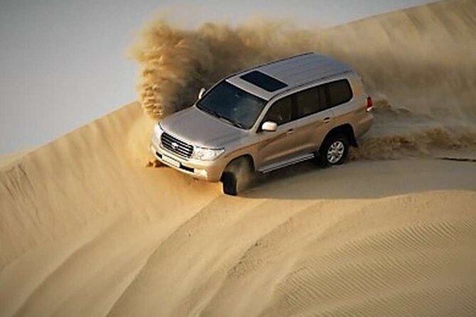 Desert Safari, Camel ride and Inland Sea Tour - Dune bashing across the Qatari sand
