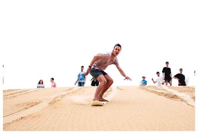 Desert Safari Combo: Camel Ride, Sandboarding & Inland Sea Visit - One hour of dune bashing and sandboarding
