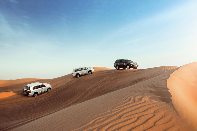 Desert Safari Dubai with Dune Bashing, Sandboarding, Camel Ride, 5 Shows, Dinner - From Dubai pickup to the Al Awir desert