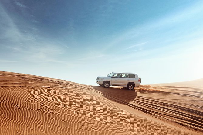 Desert Safari Dubai with Dune Bashing, Sandboarding, Camel Ride, 5 Shows, Dinner - Dinner and the evening show