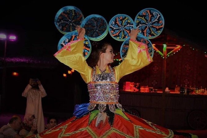 Desert Safari Red Dunes with Camel Ride, Sandboard, BBQ and Shows - A Bedouin-style camp with simple cultural activities