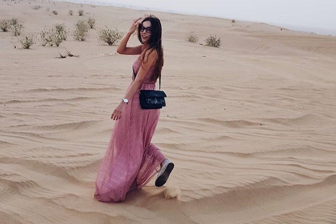 Desert Safari Red Dunes with Camel Ride, Sandboard, BBQ and Shows - Belly dance, tanoura, and fire shows after dark