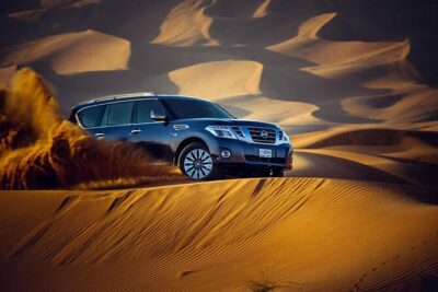 Desert Safari with BBQ Dinner, Camel Ride, Sand Board & Live Show