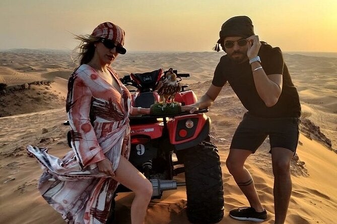 Desert Safari With BBQ Dinner, Quad Ride And And Sand-boarding - A photo stop, sandboarding, and a short camel ride