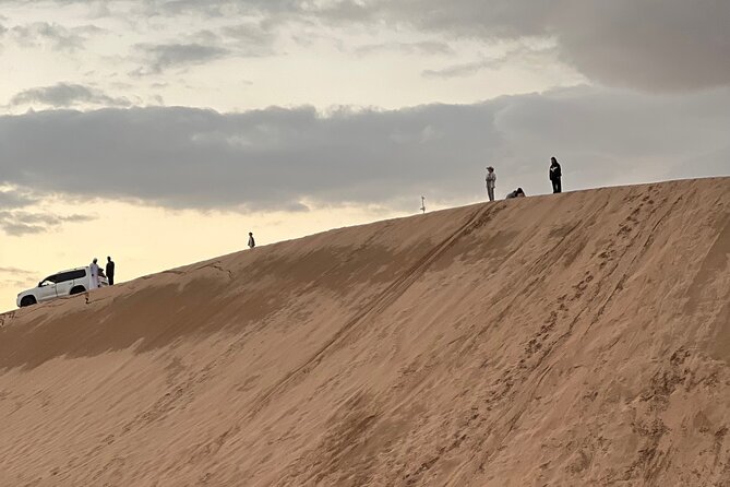 Desert Safari with Dune Bashing and Camel Ride plus Sand Boarding - Camel Riding and Sand Boarding at Camp