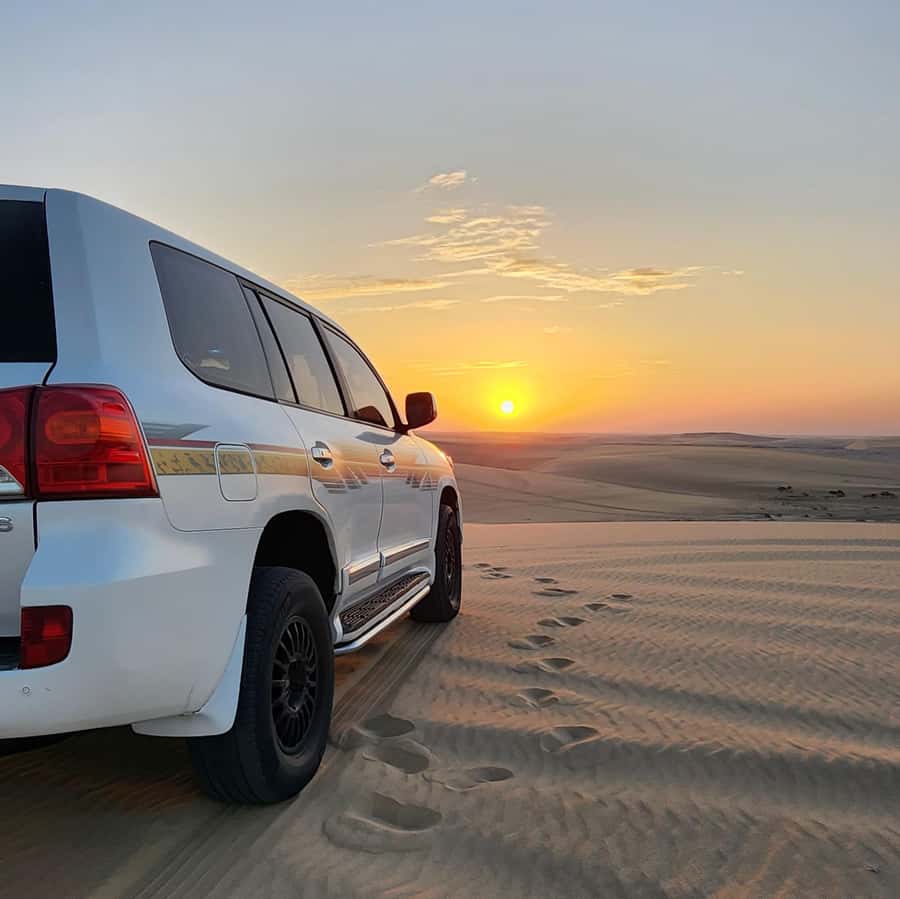 Doha: Desert Safari, Adventure, Sandboarding and Camel Ride - Sandboarding on Qatar’s soft dunes
