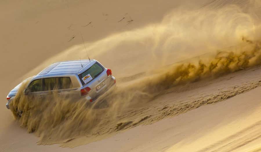 Doha; Desert safari, camel ride, sandboarding, Inland Sea - Khor Al Adeid, where the dunes meet the sea