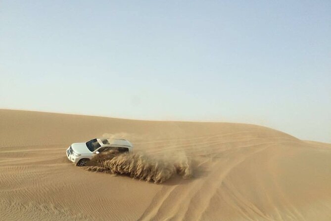 Doha Desert Safari Dune Bashing Camel Ride - Sandboarding on Qatar’s soft slopes