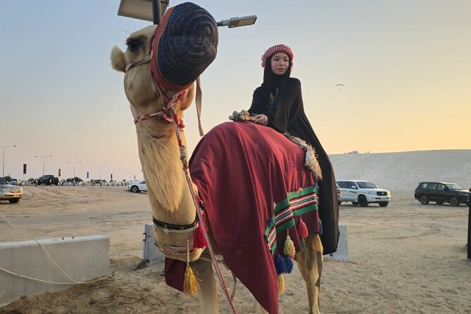 Doha Desert Safari Dune Bashing Camel Ride - Sunset colors and the Inland Sea