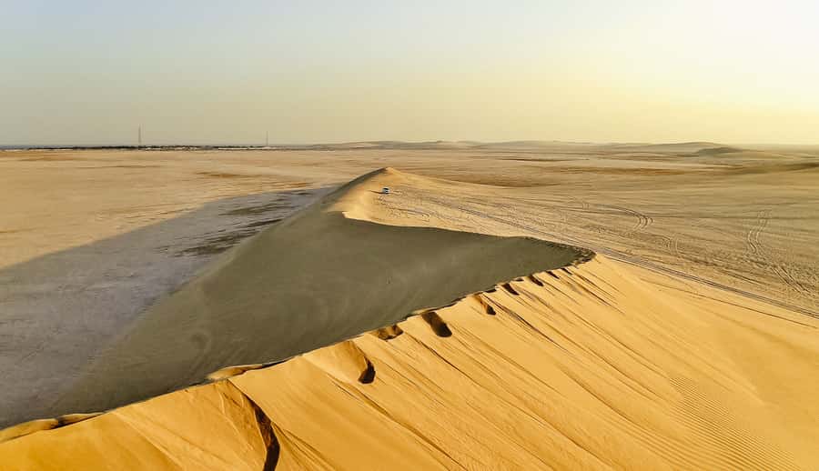 Doha: Desert Safari Dune Bashing, Sandboarding, & Camel Ride - Leaving Doha for Qatar’s southern desert