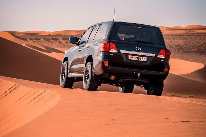 "Doha Desert : Safari, Sandboarding, Camel Ride & Inland Sea" - Sandboarding on soft, open dunes
