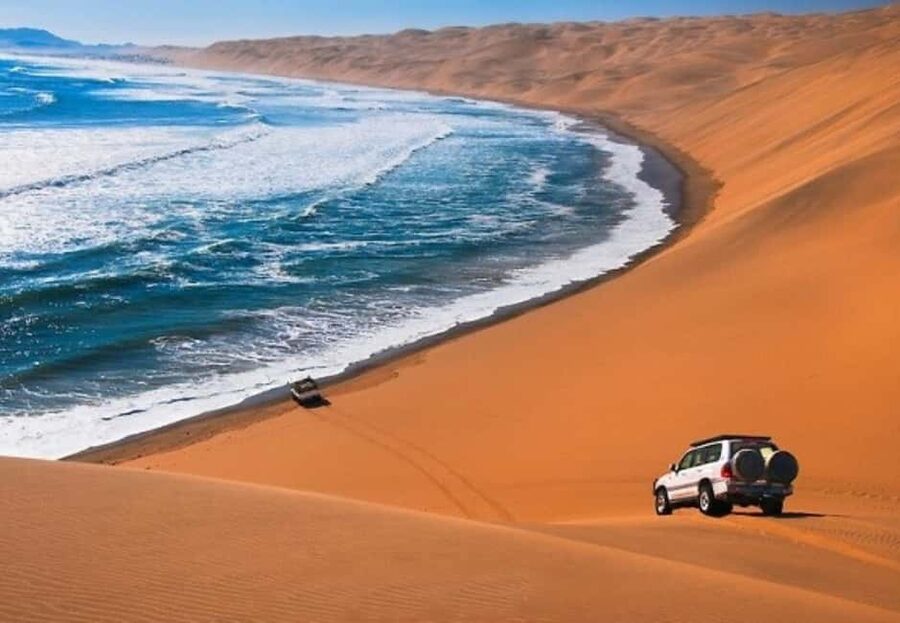 Doha: Desert Safari to the Inland Sea with All Activities - Sandboarding on the soft dunes