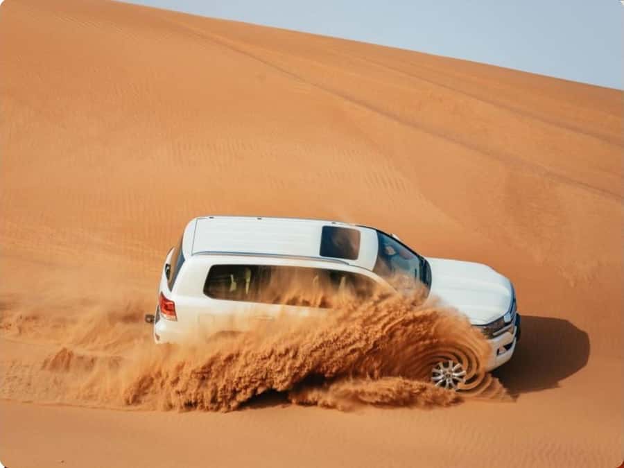 Doha:Desert Safari with Camel Ride, ATV Bike,& Sand Boarding - From Doha pickup to open desert
