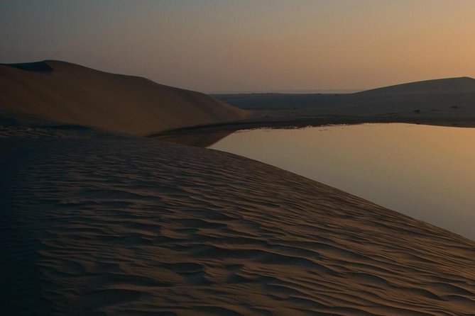 Doha: Desert Safari With Quad bike ,Camel Ride And Sand Boarding - Khor Al Adaid, where sea meets sand