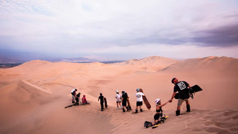 Doha: Dune Bashing Safari, Falcon, Camel, ATV, Sandboarding - Sandboarding from Qatar’s taller dunes
