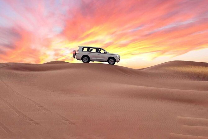 Doha Half Day Desert Safari with Camel Ride and Sand Boarding - Khor Al Udaid: where sand meets the Inland Sea