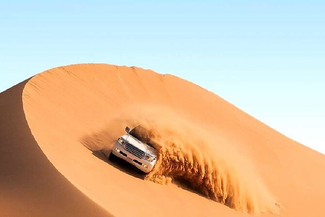 Doha Half Day Desert Safari with Camel Ride and Sand Boarding - Sealine Beach: camels, tea, and tire preparation