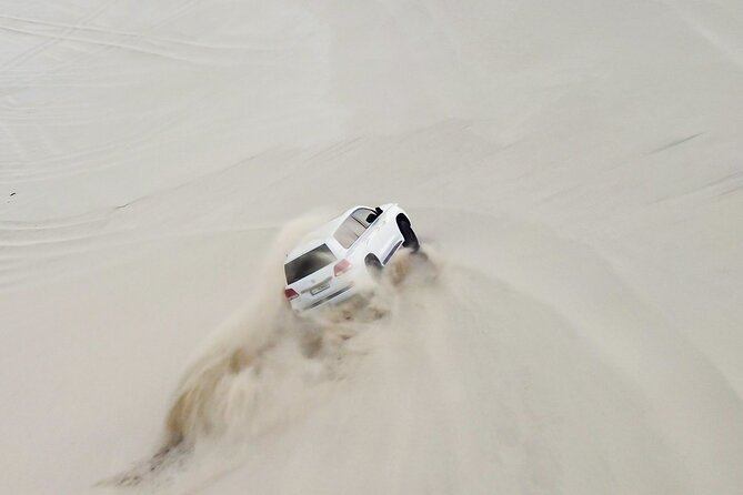 Doha-Half Day Safari with Quad Bike ATV/Camel Ride/sandboard - Camel riding: brief, traditional, and good for a photo