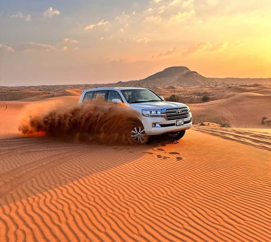Doha: Inland Sea Desert Safari with Sunset & Sunrise Views - Dune bashing across Qatar’s golden sand