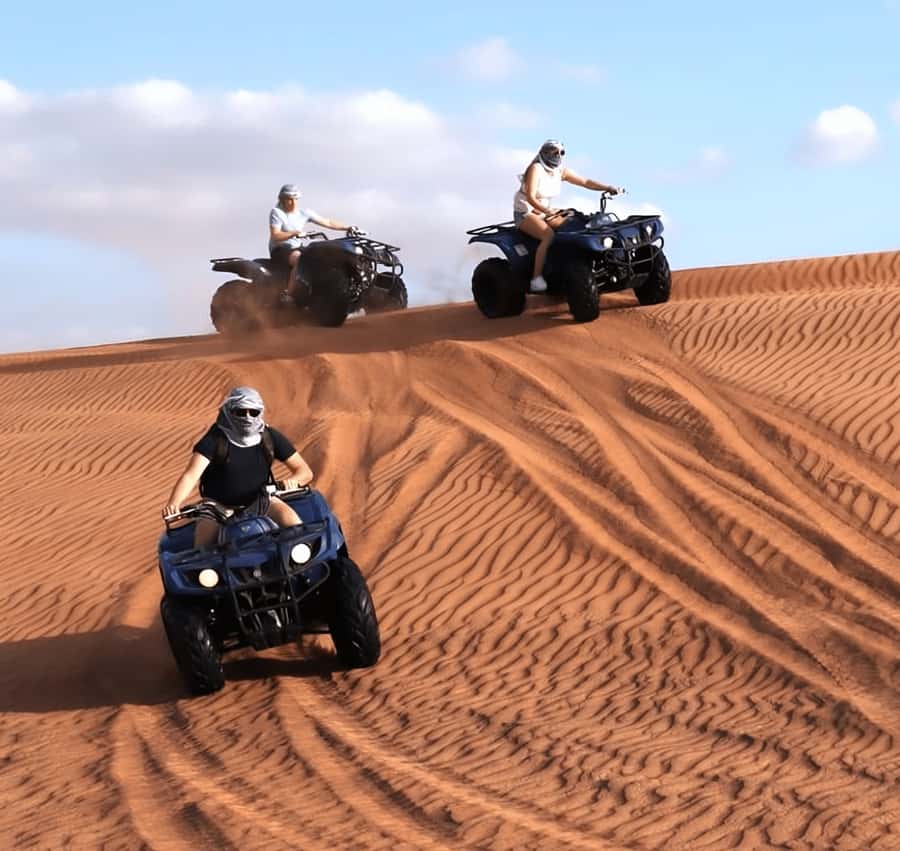 Doha Safari: ATV Ride, Dune Bashing, & Sandboarding Fun - Dune bashing across Qatar’s sand