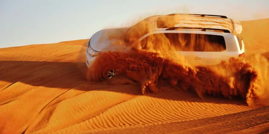 Doha: Safari, Camel Ride, Sandboarding and Inland Sea Tour - Sandboarding on soft, steep slopes