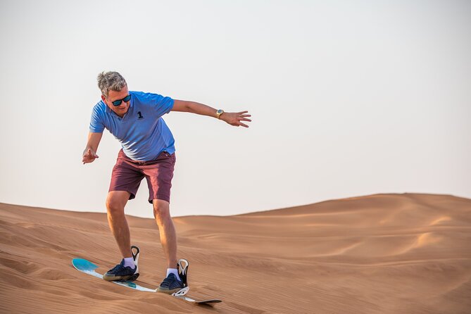 Doha: Safari, Dune bashing, Camel Ride, Sandboarding & Inland Sea - Sandboarding on the golden dunes