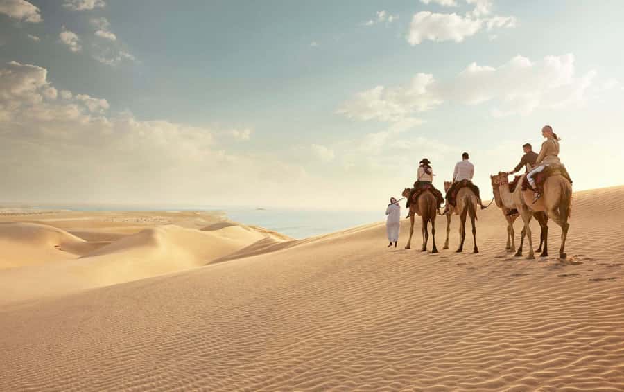 Doha:Sunrise or Sunset Desert Safari Tour with Sand Boarding - Sandboarding on the dunes