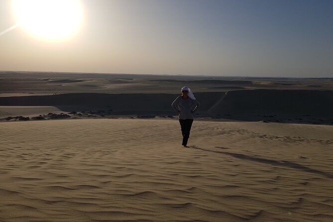 Doha: Sunrise /Sunset Desert Safari with Sand Boarding,Camel ride - Dune bashing in an air-conditioned 4x4