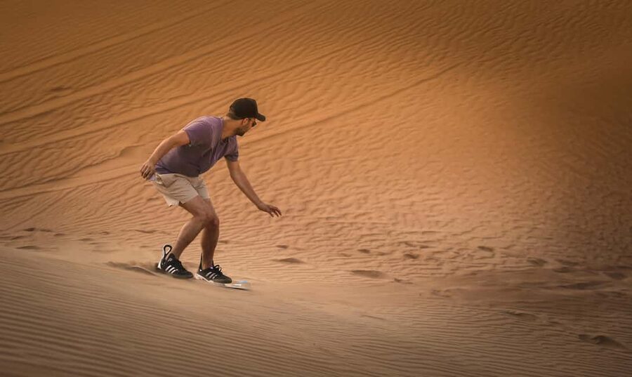 Doha: Sunset Desert Safari, ATV, Camel Ride and Sandboarding - Sandboarding gives you a taste of desert sport