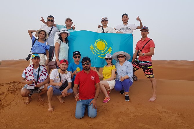 Dubai 4x4 Desert Safari, Quad Bike, Camel Ride & BBQ Dinner - Sandboarding and the sunset photo stop