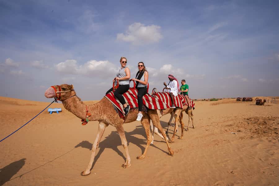 Dubai: Adventure Quad Bike Safari, Camel Ride & Refreshment - Leaving Dubai for the open sand