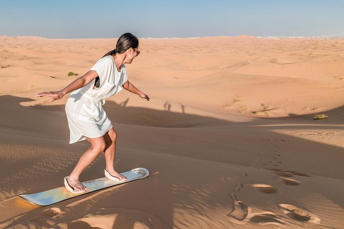 Dubai Desert Discovery: Red Dunes Safari, Sandboard & Camel Ride - Pickup from Dubai, Sharjah, or Ajman