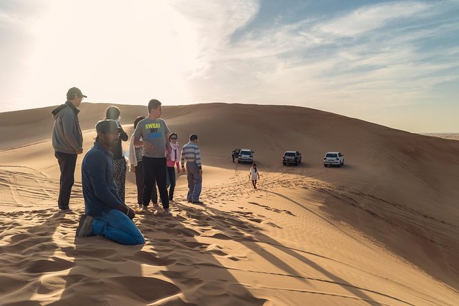 Dubai Desert Discovery: Red Dunes Safari, Sandboard & Camel Ride - Group size, atmosphere, and sales stops