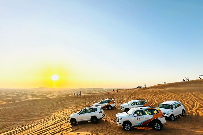 Dubai Desert Safari:BBQ Dinner, Dune Bashing & Live Entertainment - Dune bashing, sandboarding, and sunset pictures