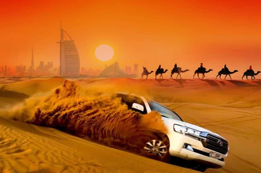 Dubai: Desert Safari Camel Riding, Sandboarding & BBQ Dinner - From Dubai hotel pickup to the open dunes